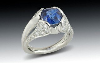 Blue Sapphire Diamond Encrusted Platinum Ring