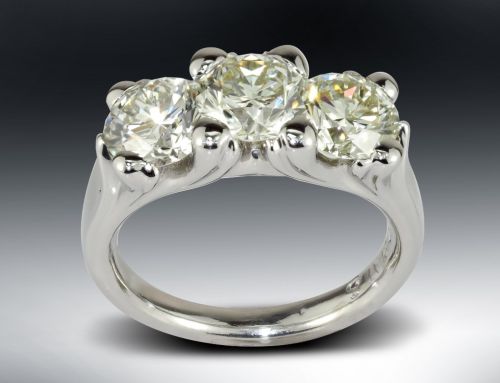 Three Stone Curved Prong Engagement Ring